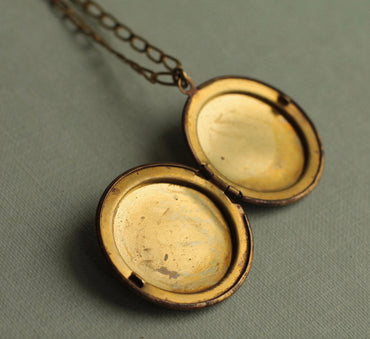 ANTIQUE BIRD LOCKET